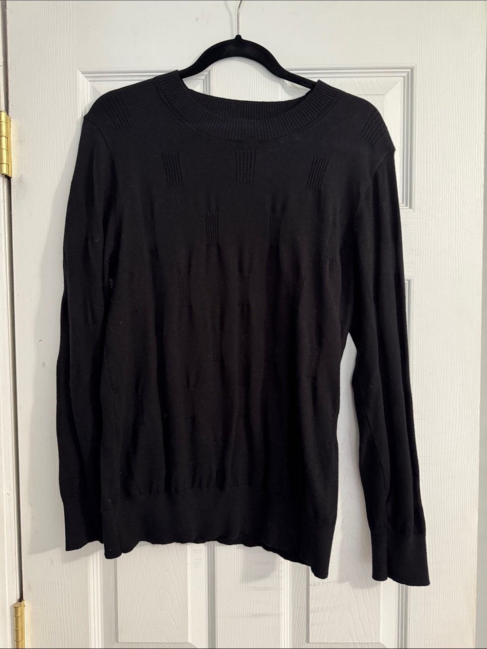 Womanโs Black Crew Neck Sweater
